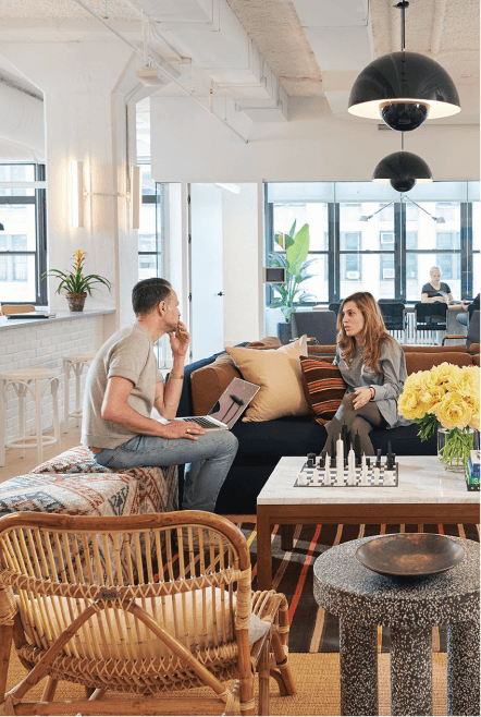 Two people chatting on a couch